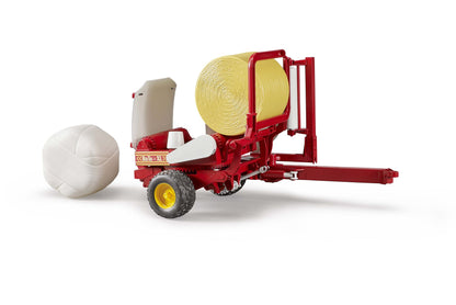 Bale wrapper with ochre and white round bales