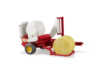 Bale wrapper with ochre and white round bales