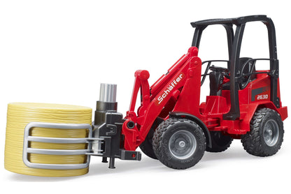 Schäffer Compact loader 2630 with bale gripper+1 round bale