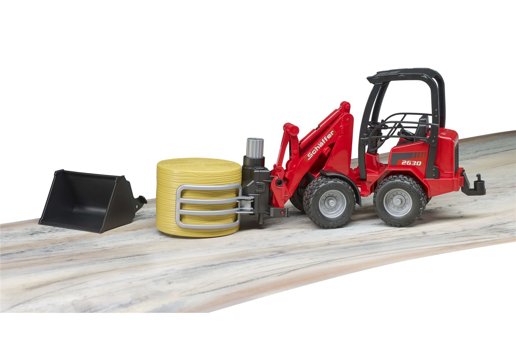Schäffer Compact loader 2630 with bale gripper+1 round bale